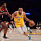 Los Angeles Lakers guard Talen Horton-Tucker (5) moves the ball against Toronto Raptors guard Armoni Brooks (1) during the second half at Crypto.com Arena.